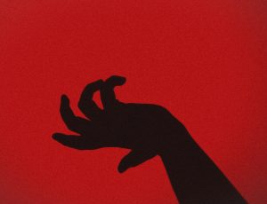 a black hand silhouette on a red back ground