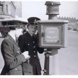 female officers at a call box