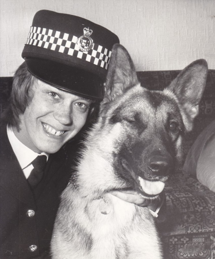 Police woman posing with police dog
black and white photo