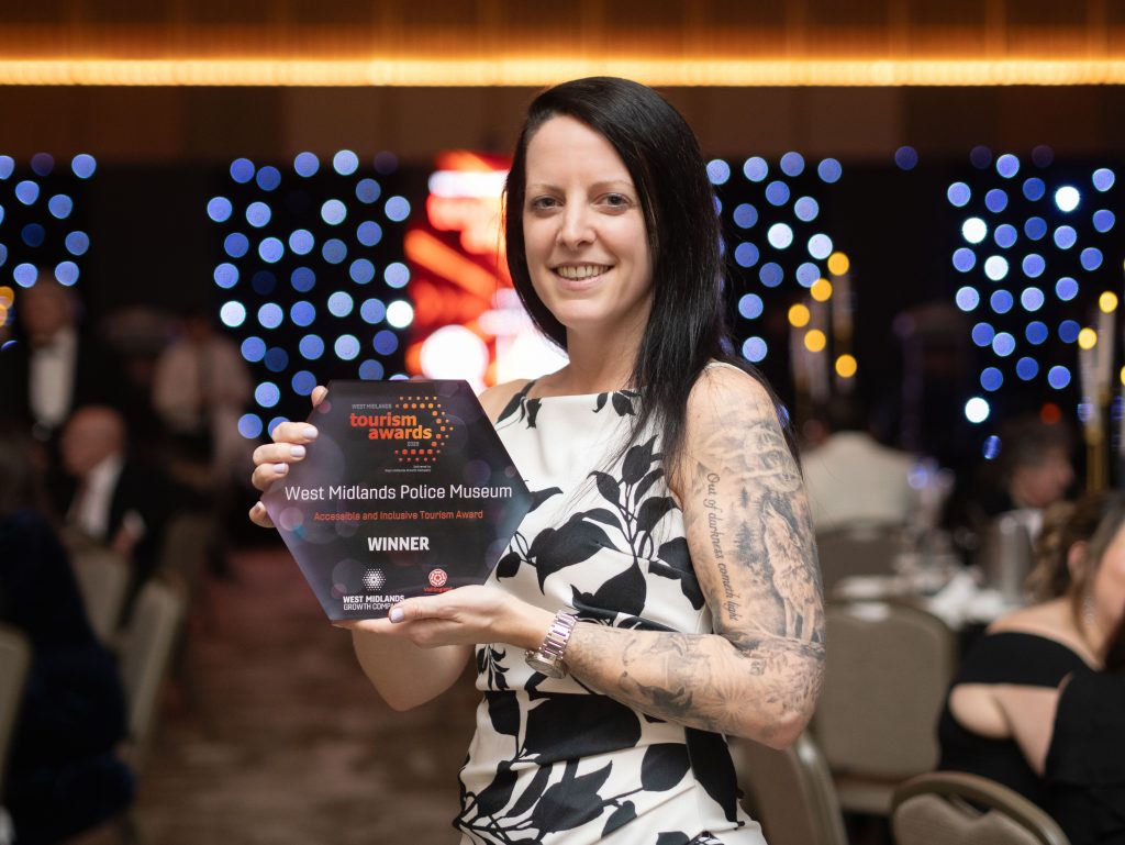 Heritage manager Corinne is pictured holding the award for Accessibility and Inclusion.